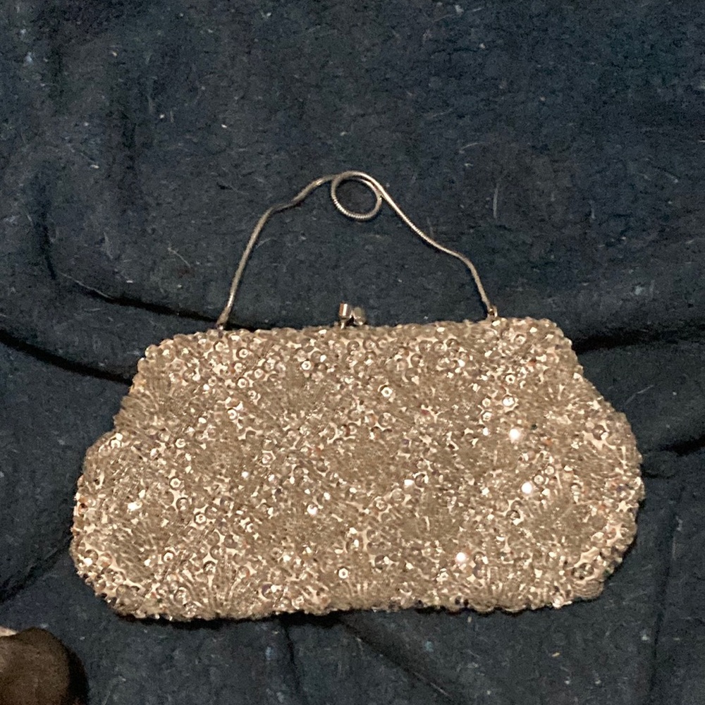 Silver sequins clutch with concealed strap